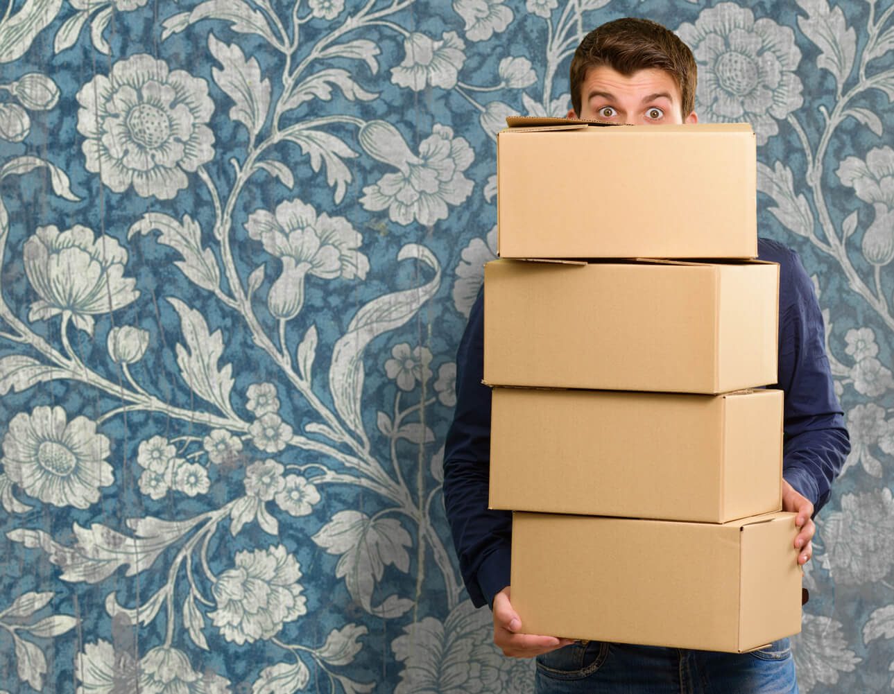 New packing. Unpacking the Box. Unpacking Boxes in the Museum. False Unpacking Box. Man holding little Box.